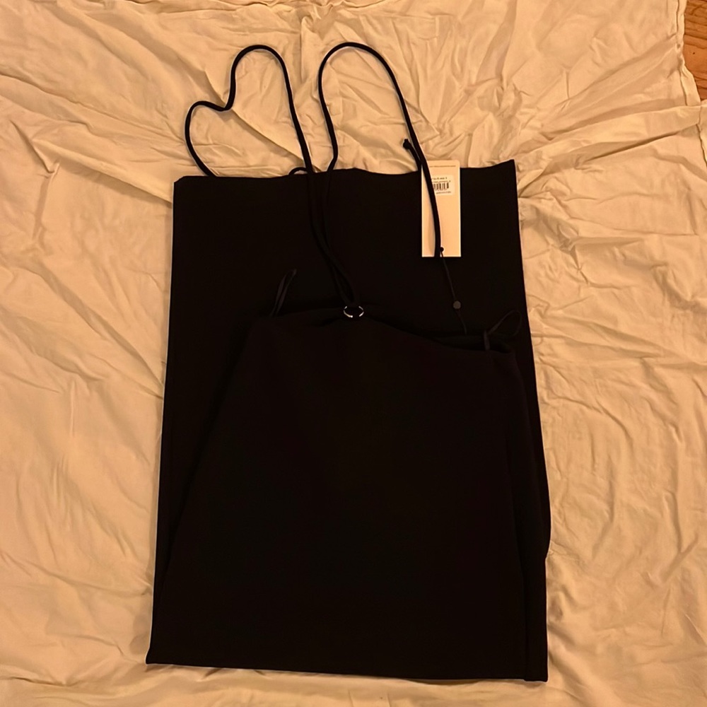Maxi black Bec and Bridge skirt with black waist straps.